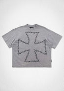 A light gray short-sleeve t-shirt with a large black graphic of a Maltese cross made of tiny dots on the front, displayed flat against a textured white background. By Fresh N Fittted.