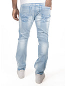 Light blue distressed jeans worn by a person on a white background. By Fresh N Fitted.