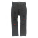 Black distressed jeans with red patches on a white background. By fresh n fitted