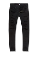 Black distressed skinny jeans with ripped details on the thighs, shown flat against a white background. By Fresh N Fitted.