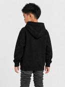 A child model shown from the back wearing a black textured hoodie and dark gray ruched pants against a light gray studio background.