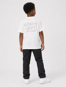 A child model shown from the back wearing a white t-shirt with a gray distressed graphic that reads 'MONEY DEPT. WORLDWIDE', paired with black jeans and white sneakers, against a light gray studio background.