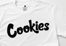 White short-sleeve crewneck t-shirt featuring the word 'Cookies' printed across the chest in a bold, black cursive-style font. The inner neck label shows the brand name 'Cookies'. By Fresh N Fitted