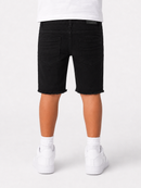 Black denim shorts with a raw frayed hem, shown on a model from the back wearing a white t-shirt, white socks, and white sneakers against a light gray background.