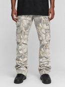 A person wearing distressed cargo pants with a light gray, beige, and white abstract print, styled with a black t-shirt and black sneakers against a light gray studio background.
