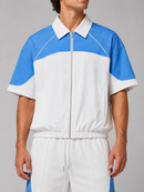 White and blue Kindred rhinestone nylon zip-up shirt with a front zipper and stylish design.
