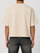 Cream Papercut 'God is Good' oversized cropped T-shirt with bold printed text on the front, casual and stylish fit.