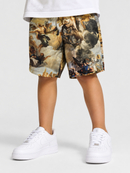 A child wearing white sneakers and white shorts with a classical painting print, standing against a light gray studio background.