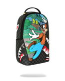 A Sprayground backpack featuring a colorful cartoon print of Goofy running in front of a shark mouth graphic on a black checkerboard background.