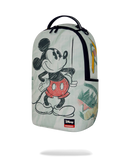 A Sprayground x Disney Mickey Mouse backpack in a light mint green color, featuring a black and red sketch-style Mickey Mouse graphic on the front, a black top handle, and a Sprayground logo patch near the bottom.