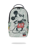 A Sprayground x Disney backpack featuring Mickey Mouse in a sketch-style black and red graphic on a pale mint green background with tropical leaf prints. The backpack has black zippers, a top handle, and a Sprayground logo patch near the bottom right.