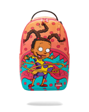 A colorful Sprayground backpack featuring a cartoon illustration of a girl with curly hair hula-hooping, set against a bright pink, orange, and teal polka-dot background.