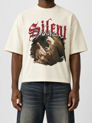 Cream oversized cropped T-shirt by Silent Verse with "Raised By An Angel" design, relaxed fit and soft fabric.