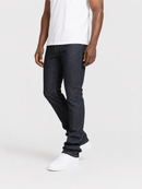 A model wearing dark wash slim-fit jeans, a white t-shirt, and white sneakers, shown from the chest down against a light gray studio background.