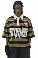 FRESH N FITTED STORM88 brown and black striped 3/4 sleeve polo shirt with studded "STORM88" graphic.