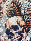 Rebel Minds cream tapestry t-shirt with a detailed skull and wings graphic adorned with rhinestones.